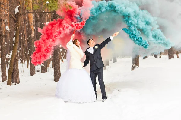 Bride and groom have fun on their winter wedding