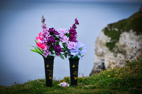 Flowers on the sea shore in remembrance