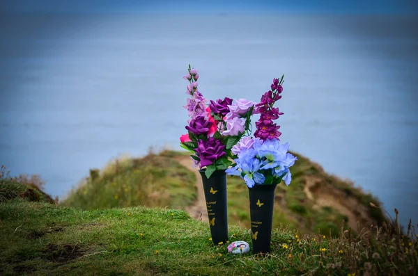 Flowers on the sea shore in remembrance