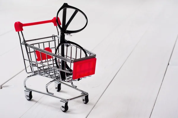 Shopping cart with reading glasses