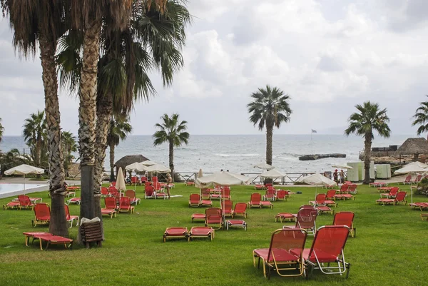 Red sun beds spread on the beach