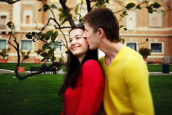 Loving couple sitting near lemon tree in the garden of the Vatican Museum