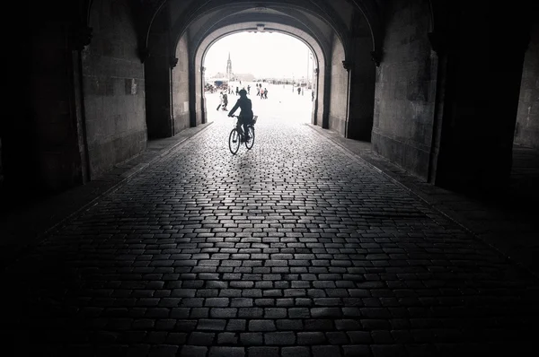 Silhouette of person on bicycle in the arch, Dresden, black and white