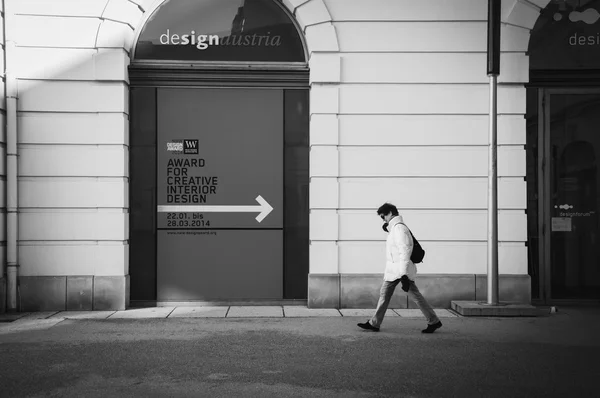 Person walking in the street, black and white