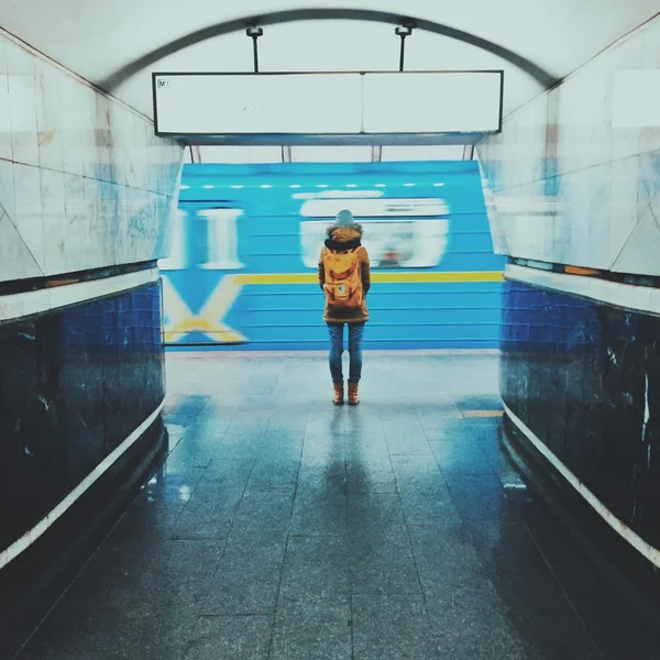 Girl in yellow at the subway station