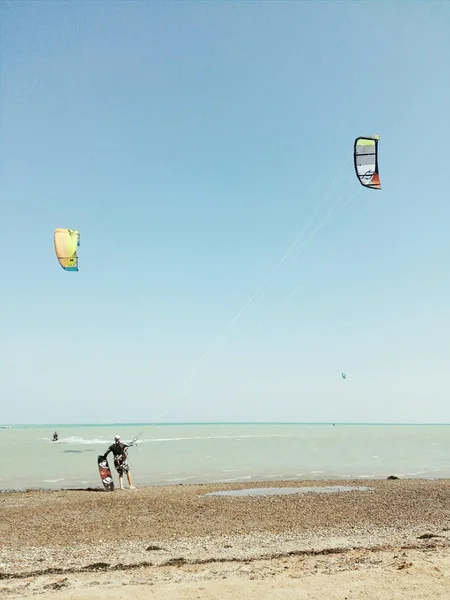 Man with kite on beach