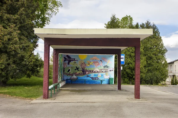 Old bus station with children\'s drawings on the wall