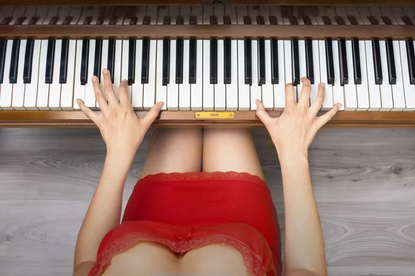 Woman\'s hands on piano