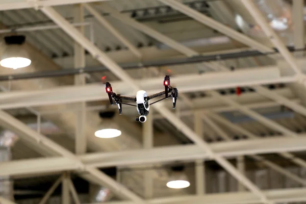 Drone flying in an industrial factory indoor