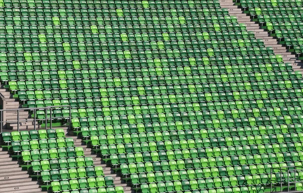 Arena with green empty tribune without people