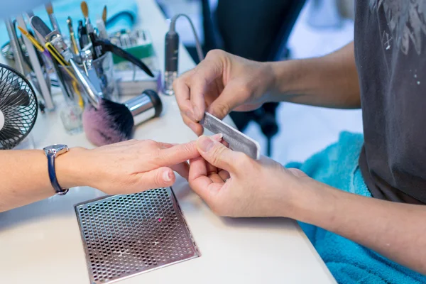 Nail Technician Working on a Elderly Woman\'s Nails