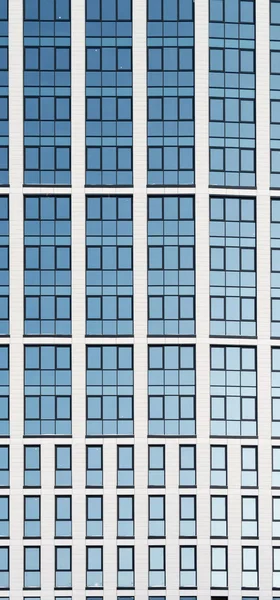 Modern High Rise Glass Building and Blue Sky