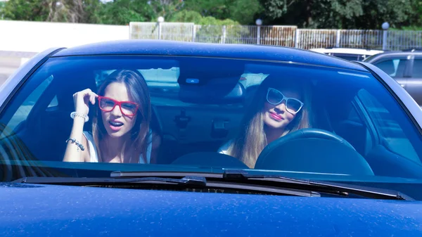 Two girls in the car.