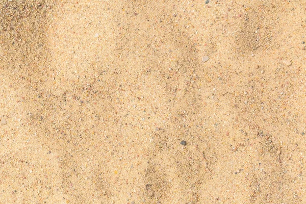 Close up of sand texture. Dry sand photographed at sunny day