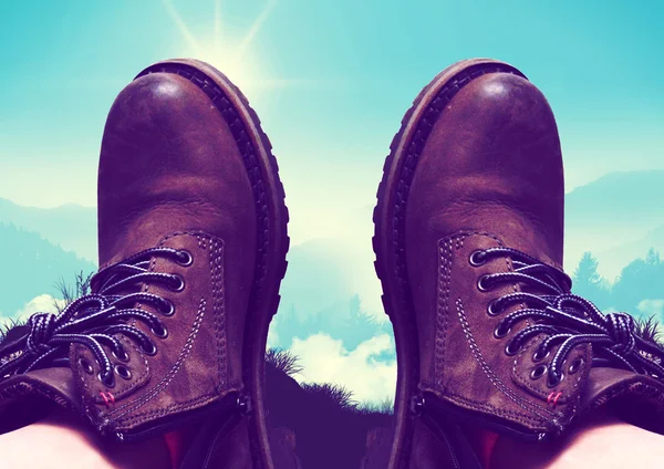 Mountain panorama walking boots in the foreground