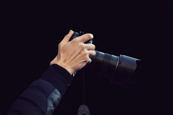 Hands holding a photo camera