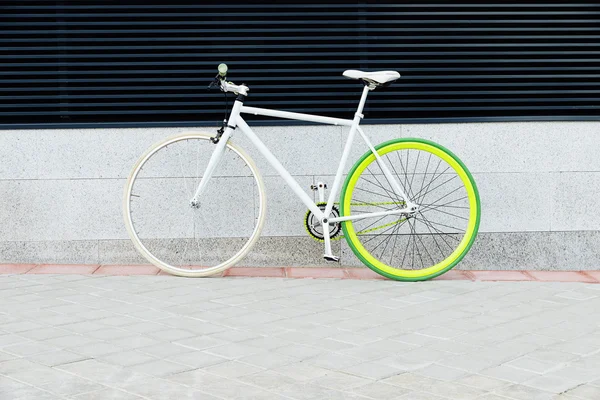 City bicycle fixed gear on wall.
