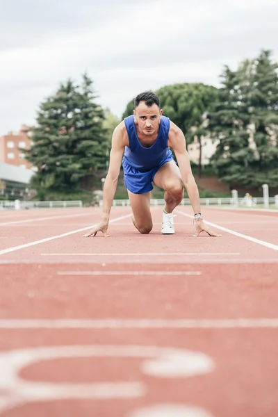 Man getting ready to start running