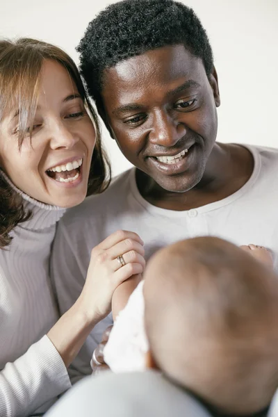 Happy Family, Mother, Father And Baby.