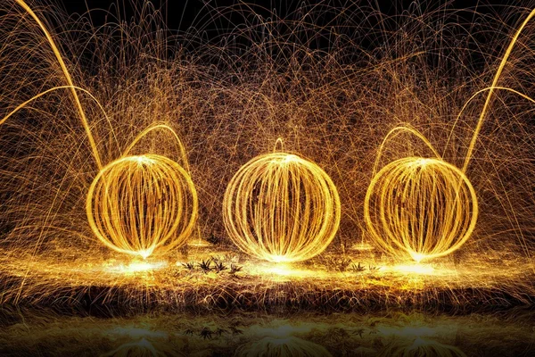 Fire balls of spinning hot steel wool