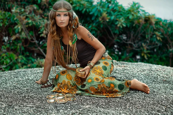 Beautiful young woman with tarot cards outdoor