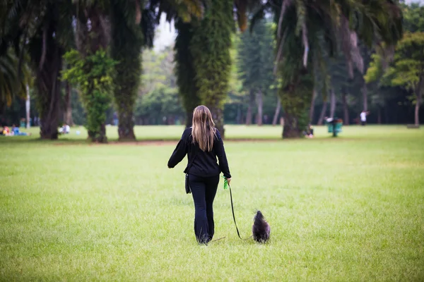 Woman Walking in the Park