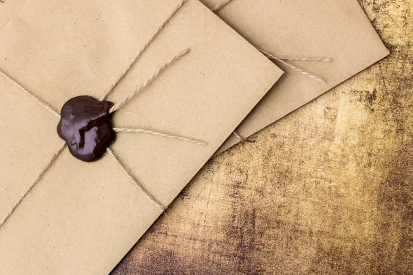 Vintage envelope with a wax seal on the table