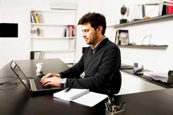 Young man start up over bookshelf background