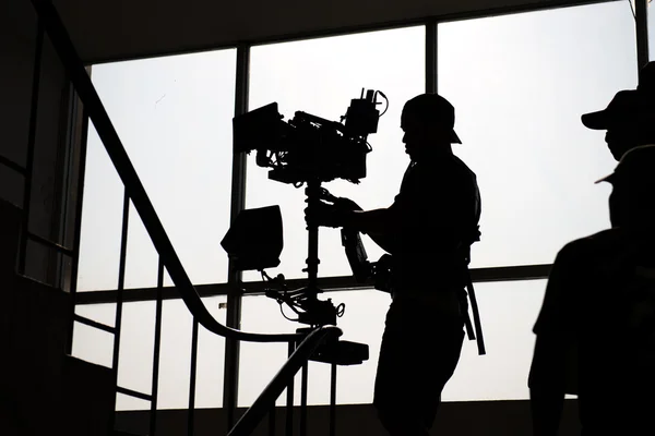 Silhouette steadicam operator in action