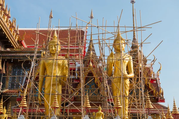 Golden Buddha statues under maintenance