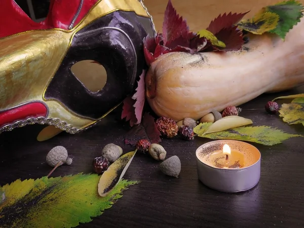 Leaves, pumpkin, mask and candle