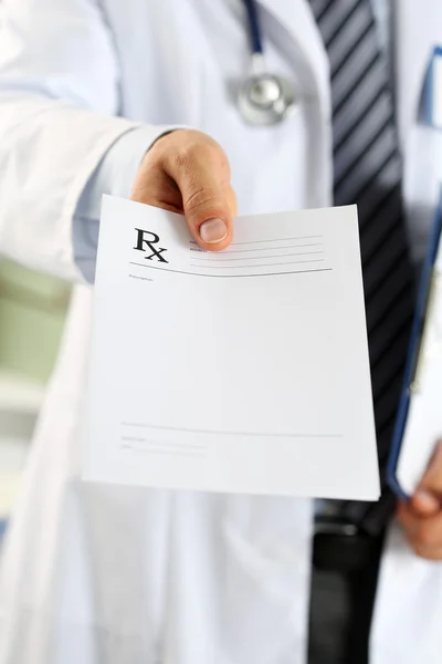 Male medicine doctor hand hold clipboard pad and give prescripti