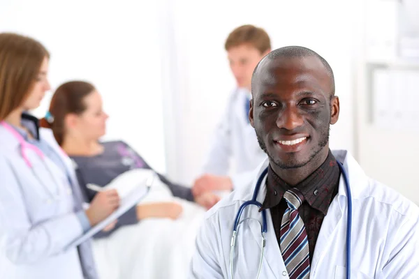 Black smiling male doctor look in camera