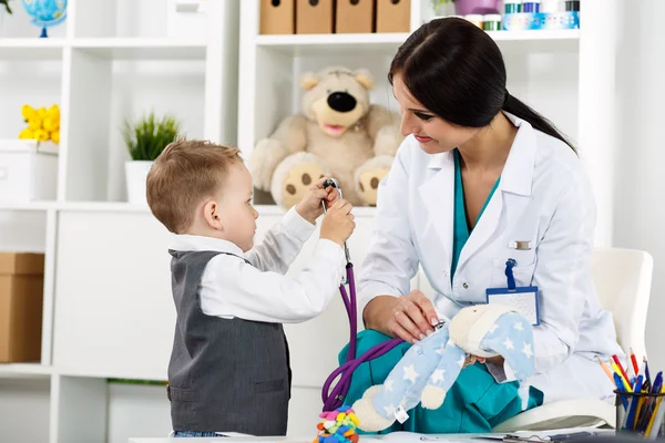 Pediatrician with patient