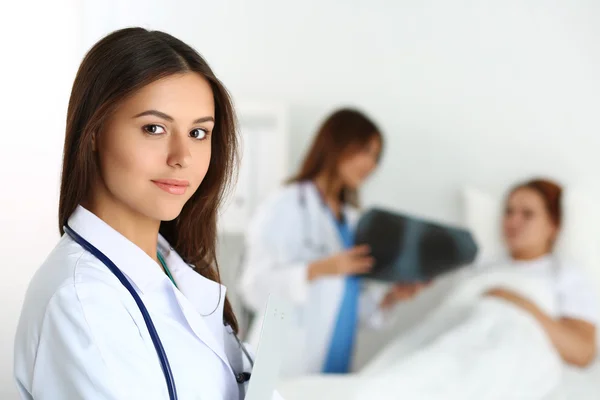 Beautiful female medicine doctor looking in camera