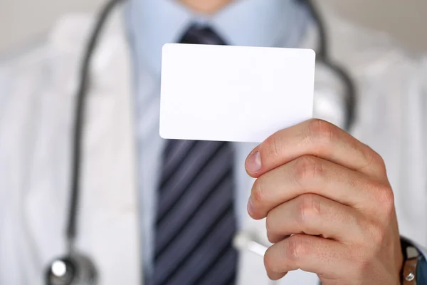 Male medicine doctor hand holding blank calling card