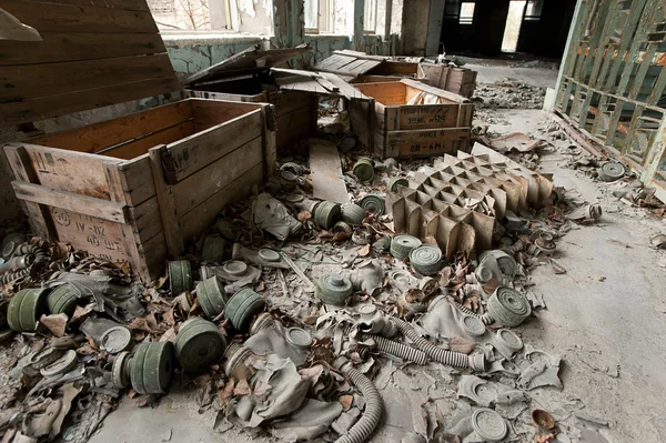 Abandoned gas masks on the floor of the school in the town of Pr