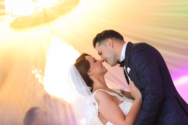 Groom and bride kissing