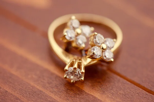 Engagement ring with golden earrings