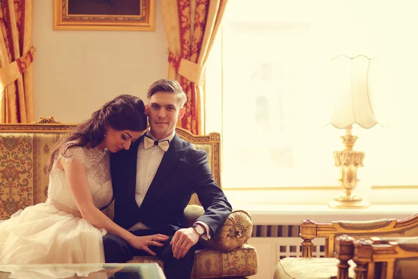 Bride and groom in a hotel room