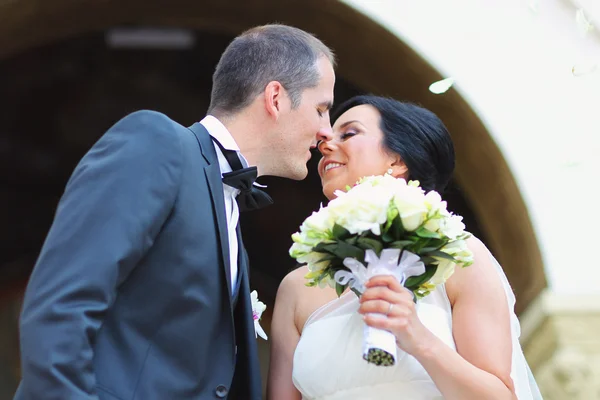 Beautiful bride and groom kissing on wedding day