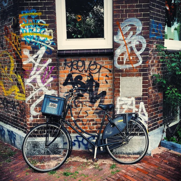 Bicycle near brick house