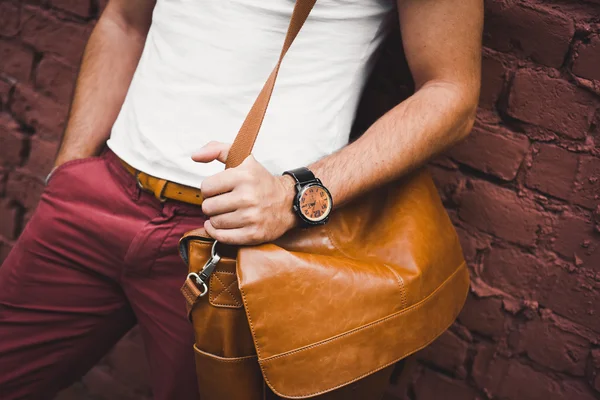 Fashion man, with casual leather bag and watch