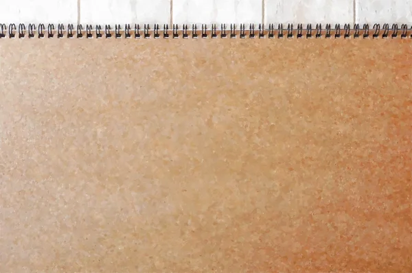 Empty blank white front page cover of spiral bound notepad on the wooden background- Water colour effect applied