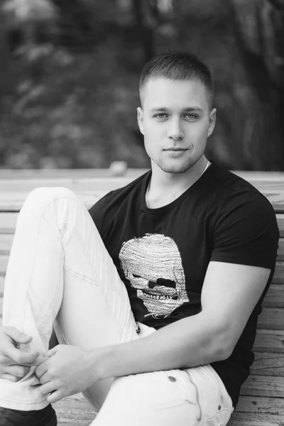 Portrait of a handsome young man in black t-shirt