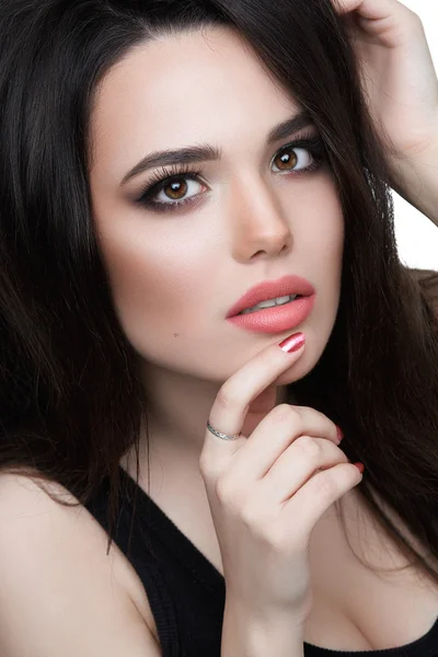 Portrait of a young brunette woman with luxury make-up.  Isolated over white background.