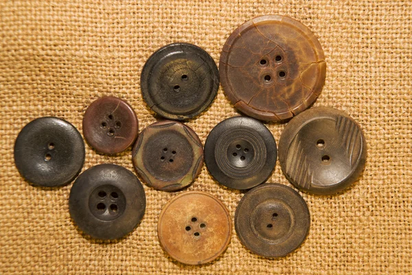 A lot of vintage buttons on old cloth