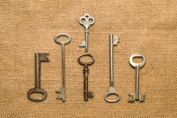 Six very old keys  on old cloth