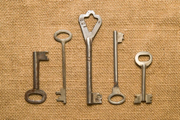 Four old keys to the safe on a very old cloth