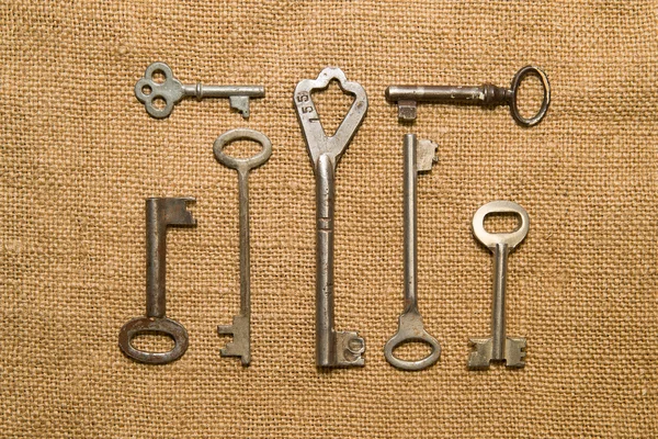 Seven very old keys  on old cloth